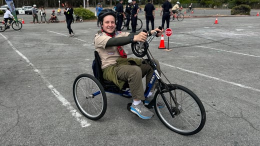 scout on adaptive bicycle